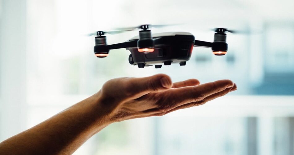 drone hovering hand 2020 unsplash