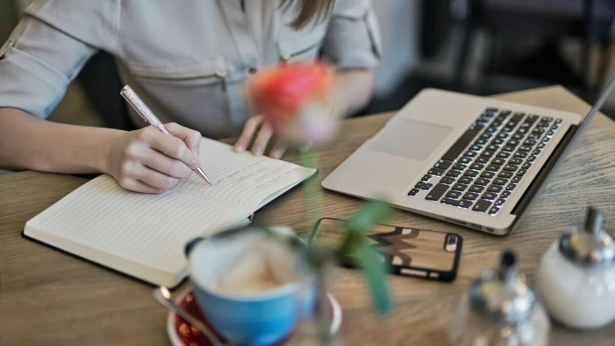 woman writing computer judit peter pexels